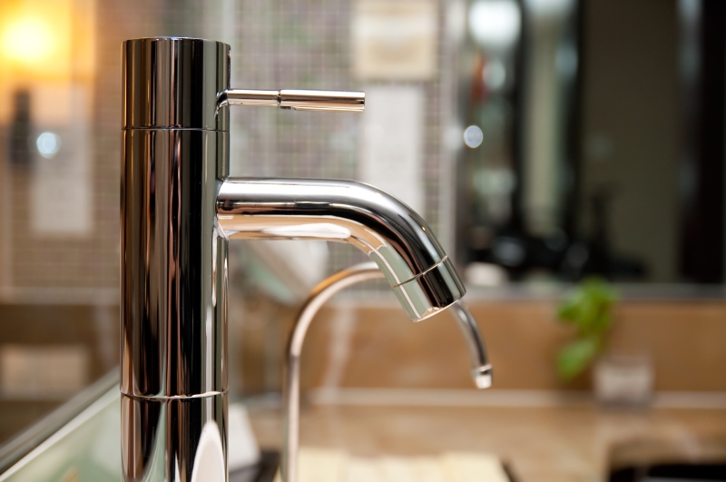 Leaking tap being repaired in Edgware